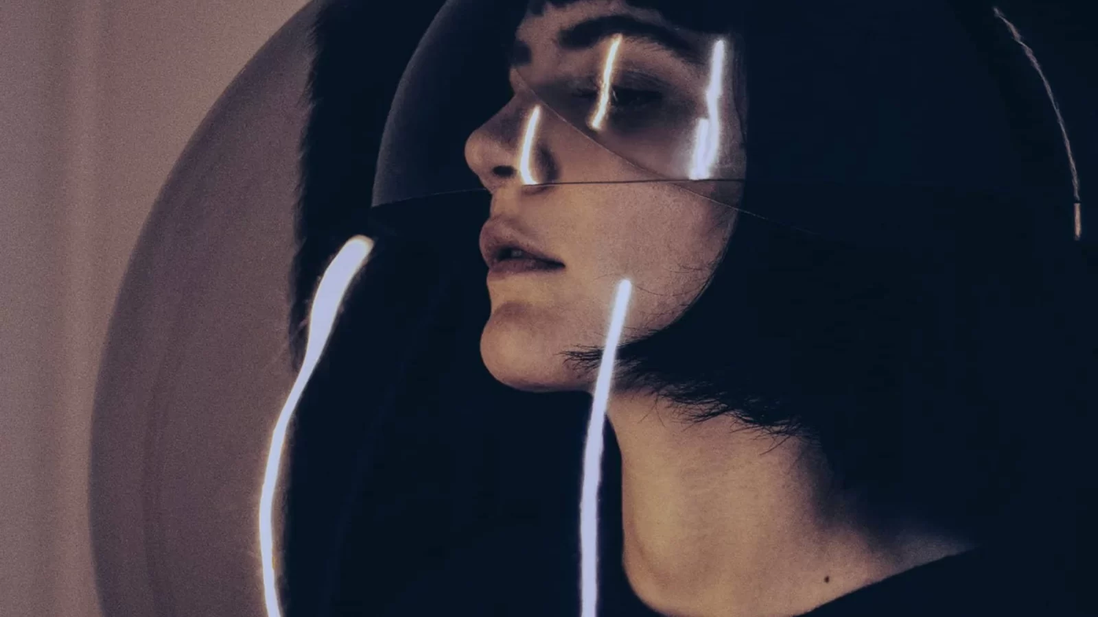Silvia Kastel seen through overlapping reflected bubbles.