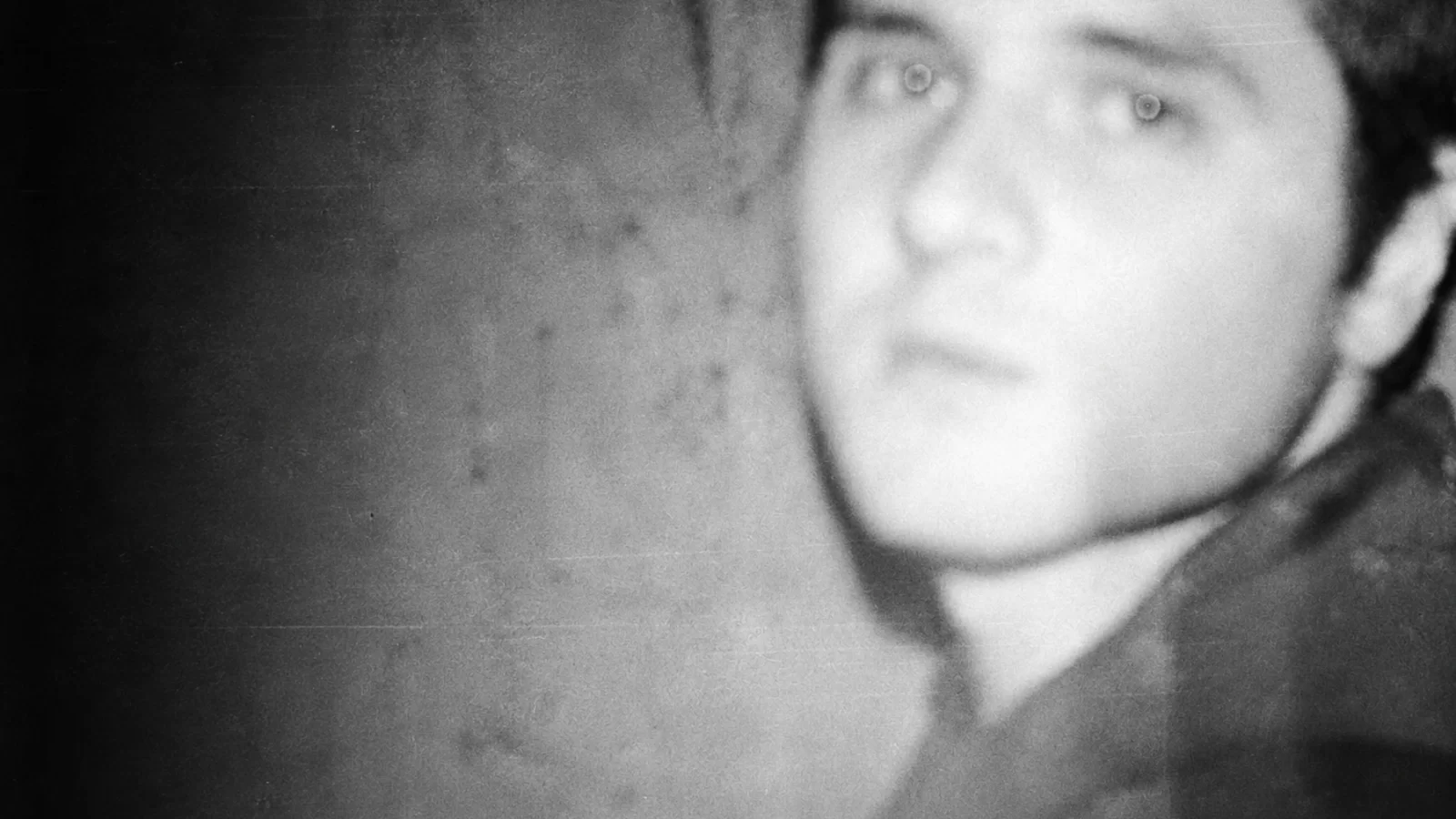 Koray Kantarcıoğlu in a softly focused, grainy monochrome portrait.