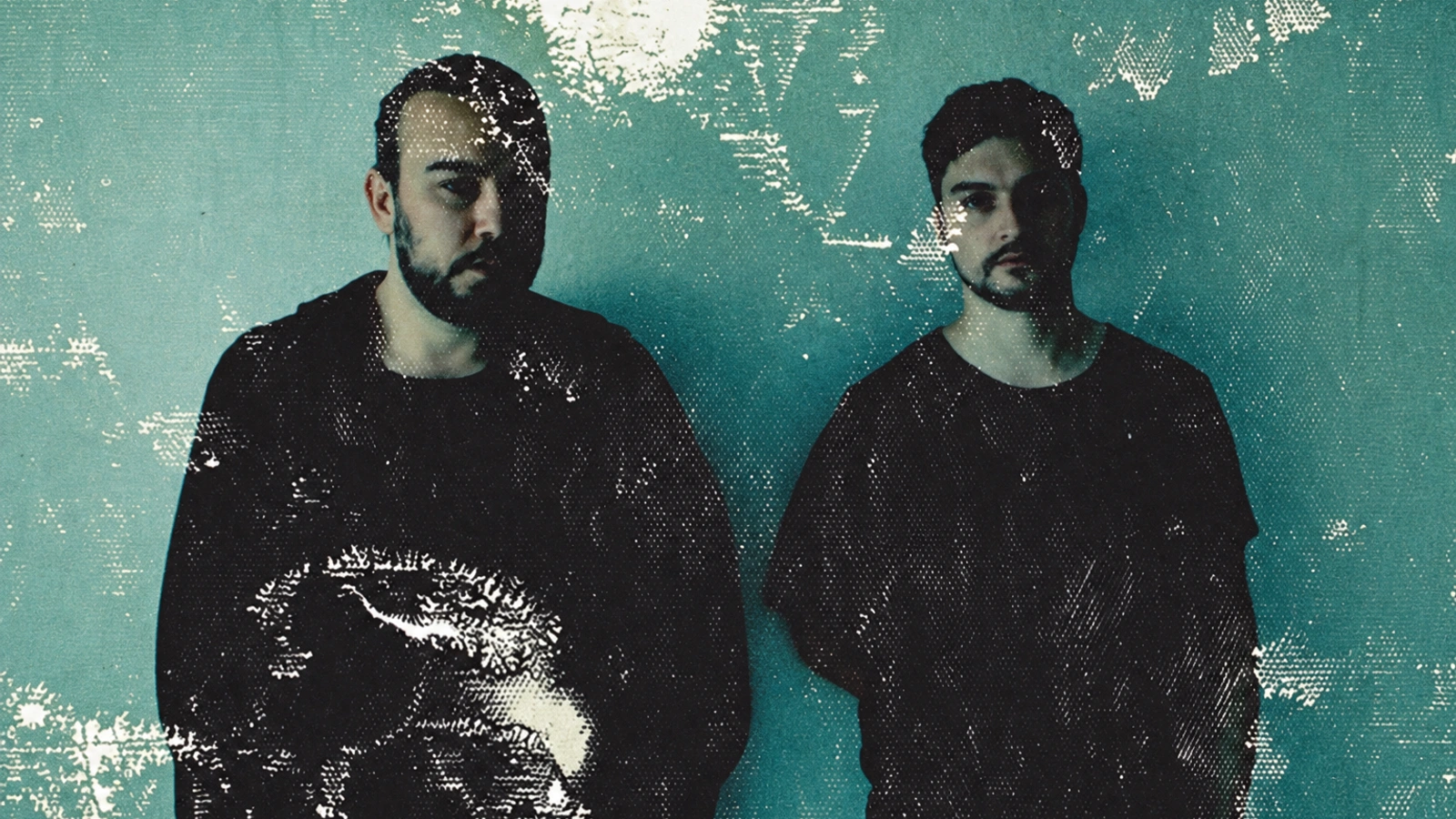 Cassegrain in a teal film-scan portrait with white chemical textures across both figures.