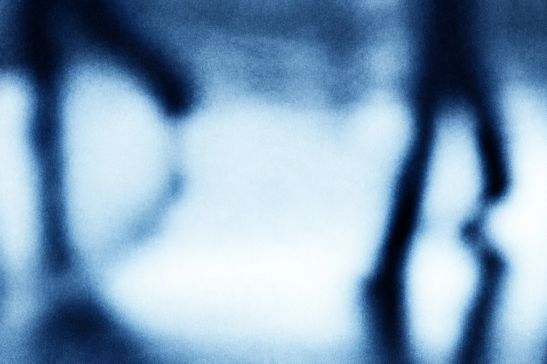 Shadows’ abstract blue, grainy photographic silhouettes.