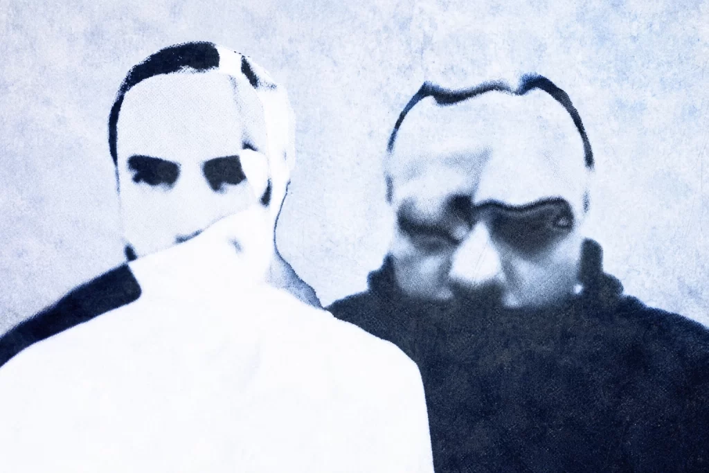 AnD, in a grainy pale-blue solarized double portrait.