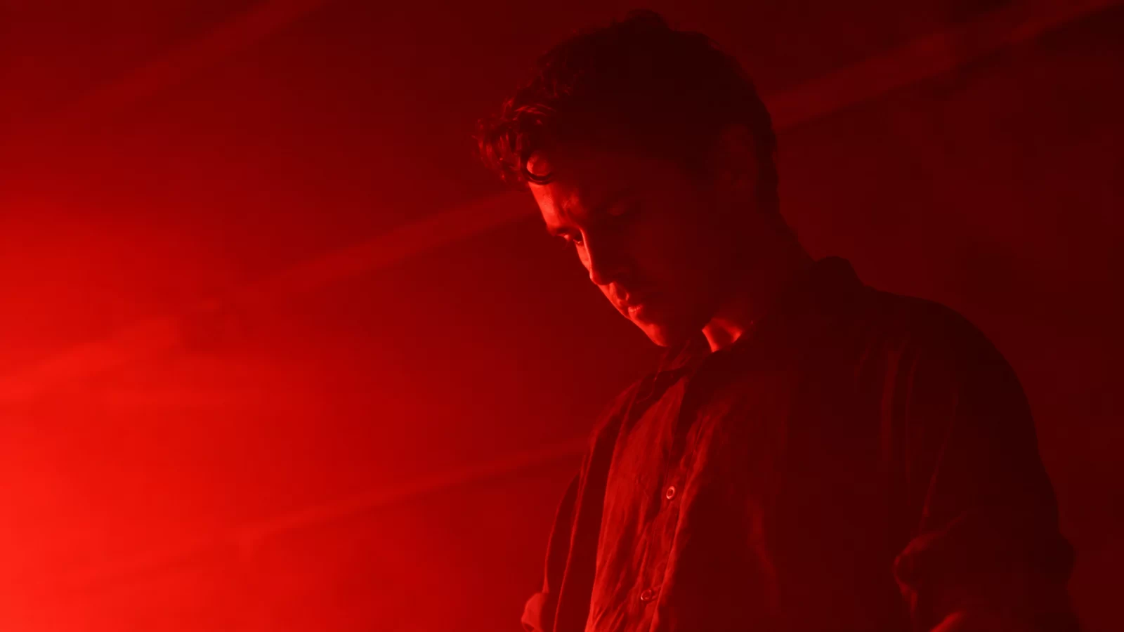 Avizohar in a red-lit portrait.