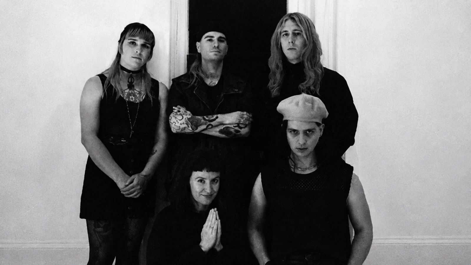 No Master, No Servant in a black-and-white group portrait.