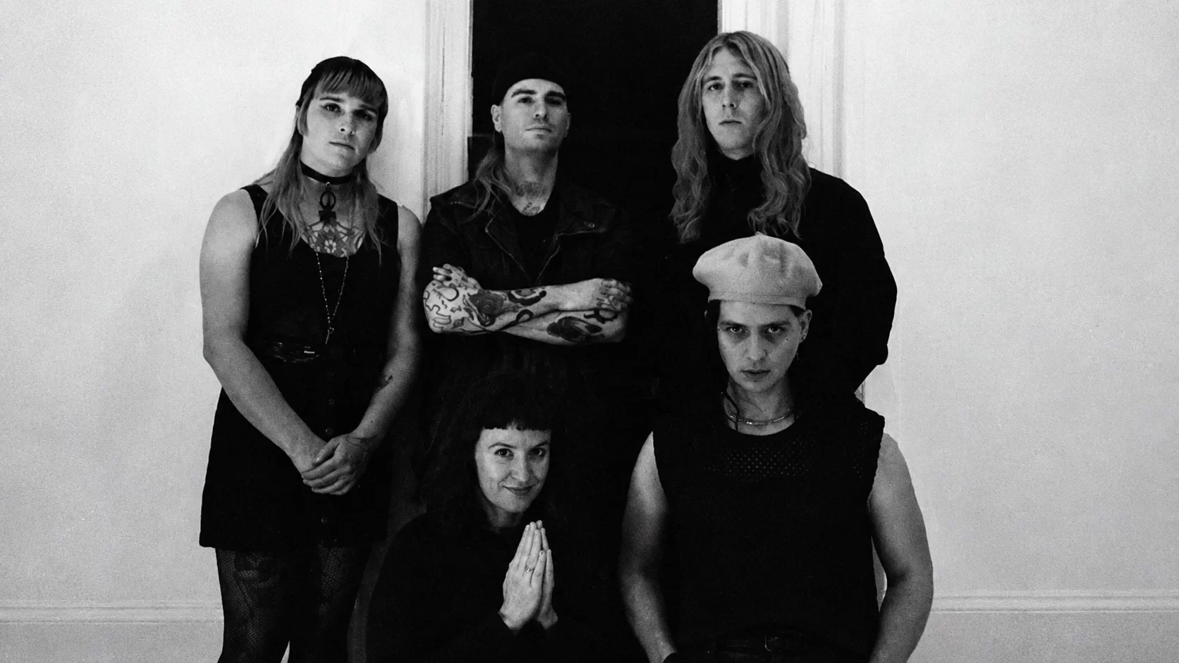 No Master, No Servant in a black-and-white group portrait.