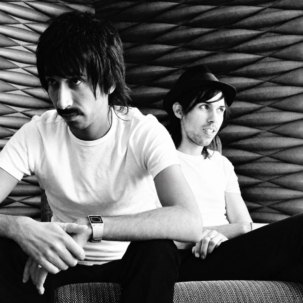 Both members of Magamura in an archival portrait