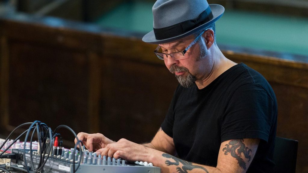 Mika Vainio adjusting audio equipment in Oslo