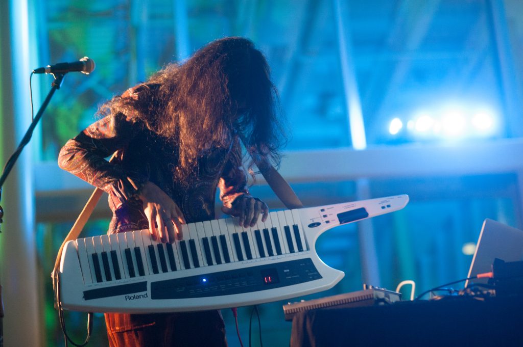 Elysia Crampton playing a keytar at OBEY Convention X