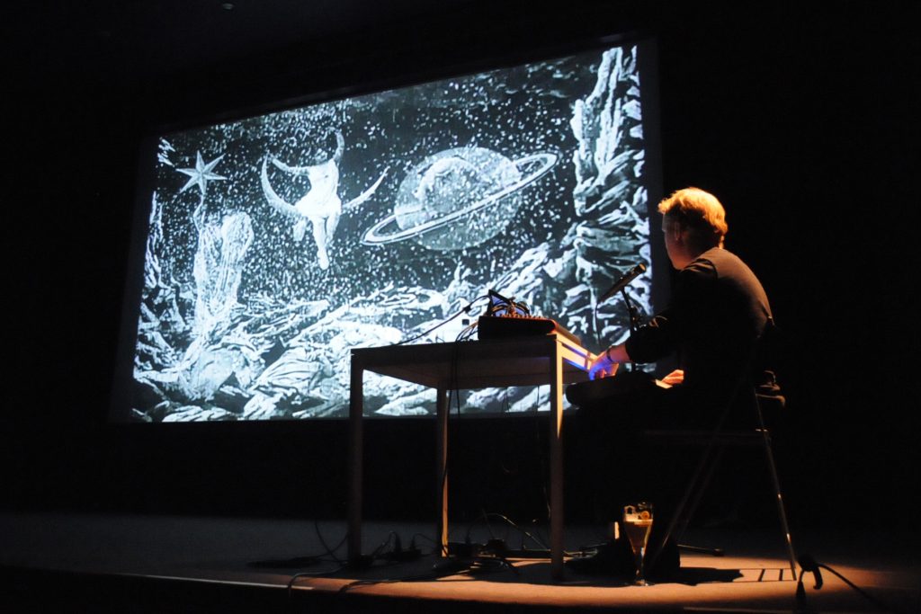 Brian Pyle accompanying a Georges Méliès screening with Ensemble Economique
