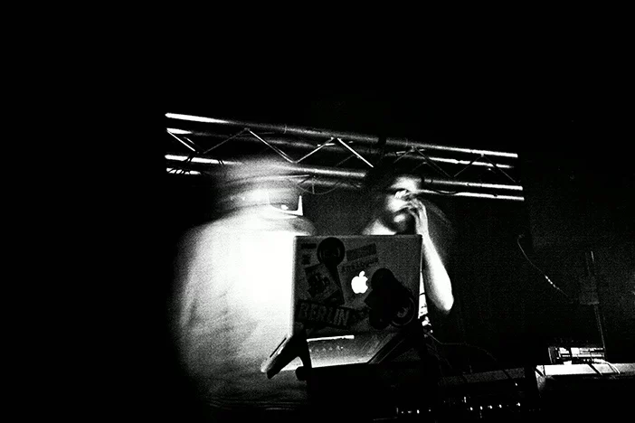 Both AnD members performing behind electronic equipment