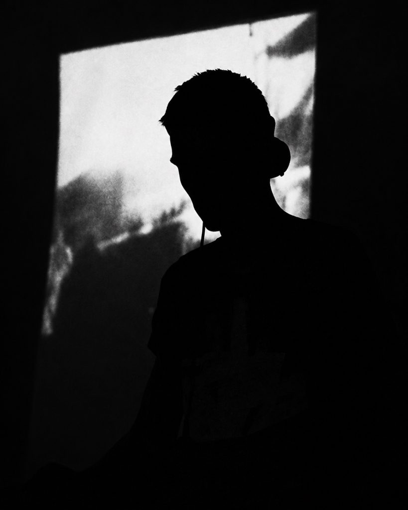 Rookas of DAI in a silhouetted portrait