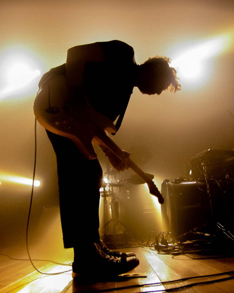 Luis Vasquez playing guitar as The Soft Moon