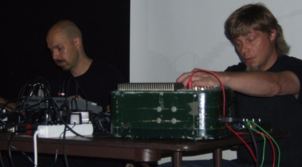 Mika Vainio and Ilpo Väisänen of Pan Sonic performing with electronic instruments