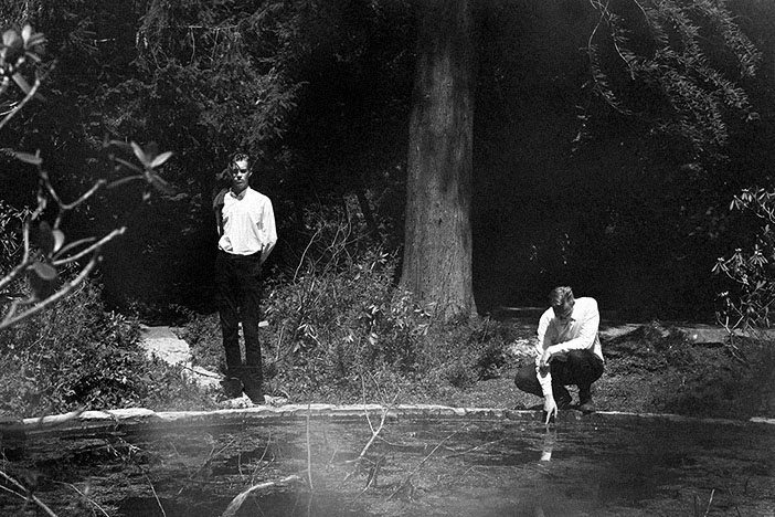 Loke Rahbek and Christian Stadsgaard in a wooded landscape.