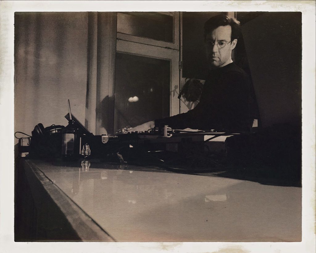 DJ M operating equipment during a performance.